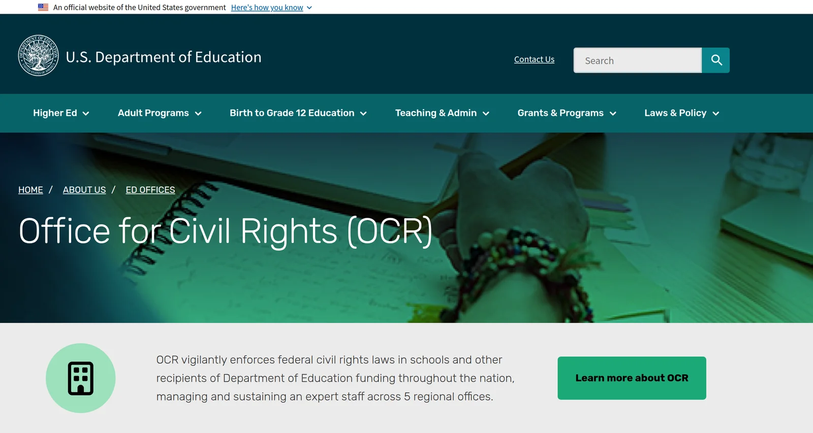 The US Department of Education's Office for Civil Rights web page, with the department's seal and navigation bar above a green-tinted photograph of a hand writing in a notebook, headed Office for Civil Rights (OCR).