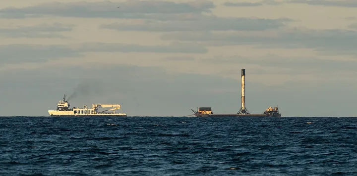 Falcon 9 booster on its droneship being towed towards Port Canaveral
