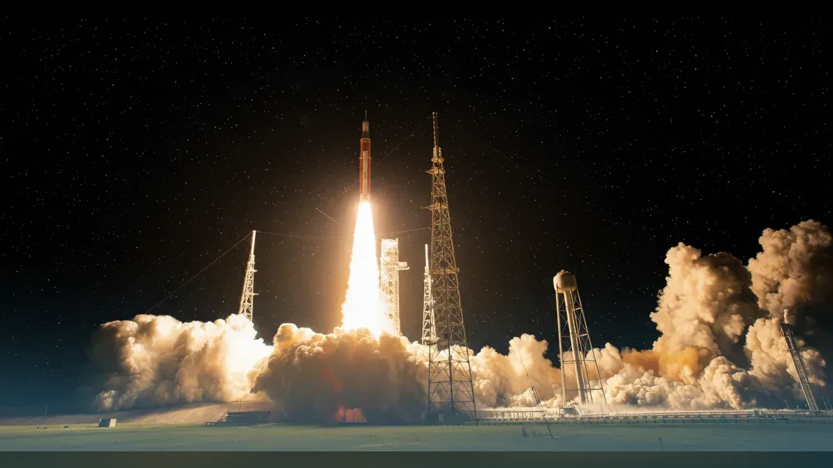 The SLS rocket carrying Orion lifting off Pad 39B on Artemis I, restyled onto a dark starfield.