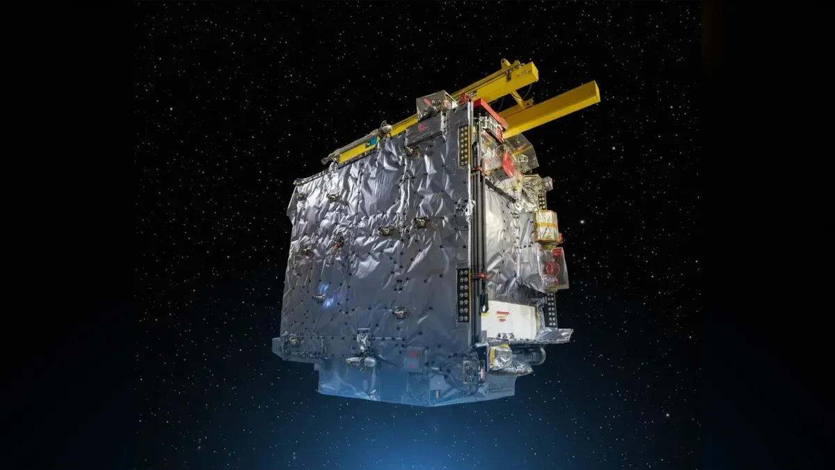The assembled JUICE spacecraft, photographed at Airbus in Toulouse, restyled onto a dark starfield.