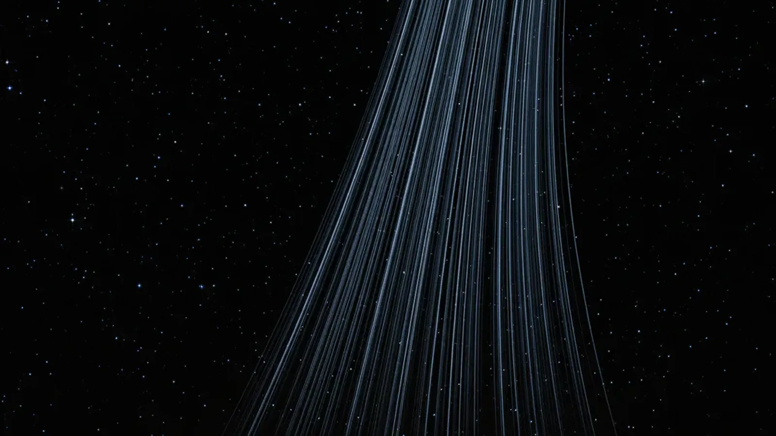 Dozens of faint rocket ascent trails crossing a black sky, all alike.